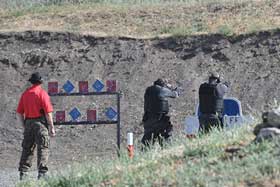 Shooter at Range with Falling Plates