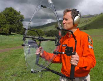 Man with parabolic microphone